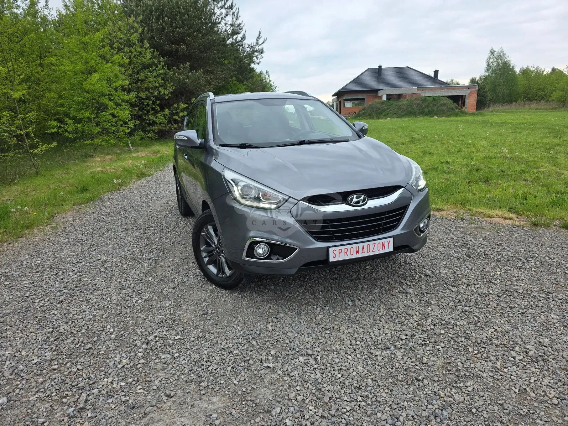 Hyundai Tucson II blue 1.6 GDi 2WD Classic 2014
